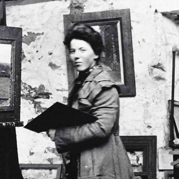 <p>Photograph of Helen McNicoll in her studio at St. Ives, c.1906, photographer unknown, Helen McNicoll artist file, The Robert McLaughlin Gallery, Oshawa.</p>
<p> </p>
<p>Banner: Helen McNicoll, <em>The Apple Gatherer</em>, c.1911, oil on canvas, 106.8 x 92.2 cm, Art Gallery of Hamilton.</p>
