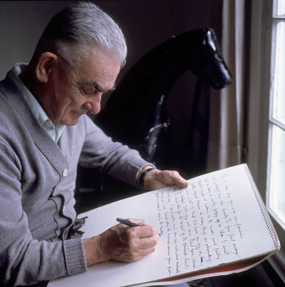 Art Canada Institute, Basil Zarov, photograph of Jean Paul Lemieux writing on a sketchpad, 1977