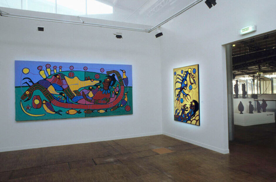 Art Canada Institute, Installation view of Norval Morrisseau’s Untitled, n.d., and Artist With Thunderbird Vision (The Visionary), 1977
