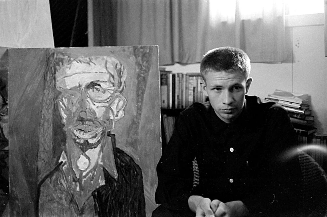 Art Canada Institute, Greg Curnoe, Greg Curnoe in his first studio in the basement of his childhood home with self-portrait Selfchildfool, 1959